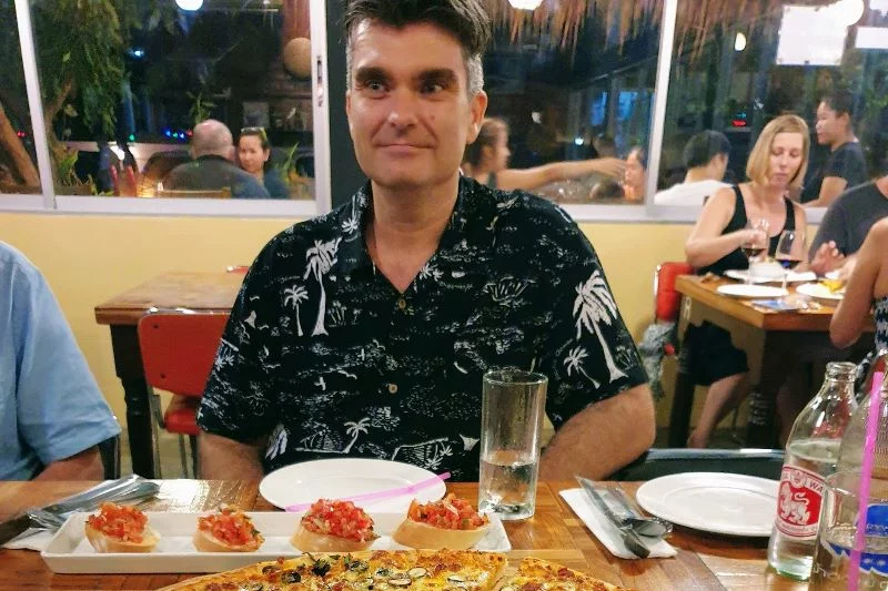 vegan sitting in pizza restaurant